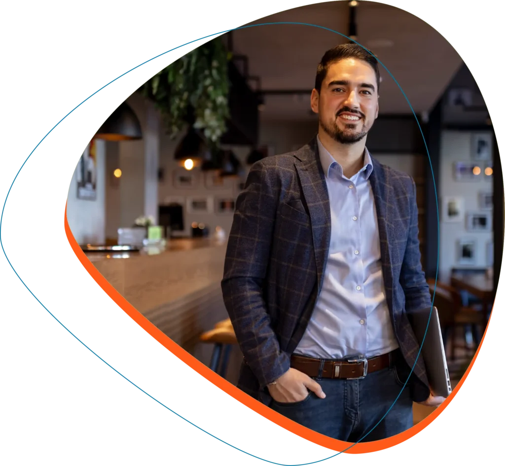 Man carrying laptop looking at camera woocommerce hosting on his mind